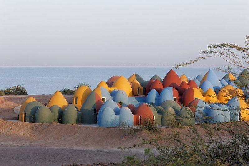 ZAV Architects Built Colorful-Domed Housing Made Of Rammed Earth And Sand On Hormuz Island, Iran