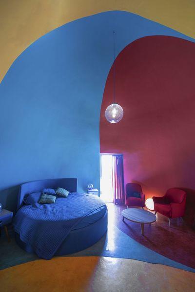 ZAV Architects Built Colorful-Domed Housing Made Of Rammed Earth And Sand On Hormuz Island, Iran