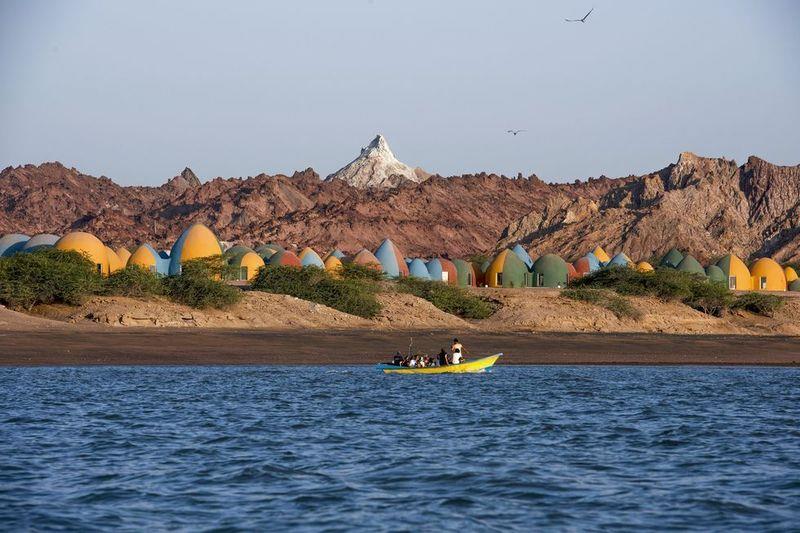 ZAV Architects Built Colorful-Domed Housing Made Of Rammed Earth And Sand On Hormuz Island, Iran