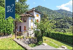 Villa with panoramic turret for sale by Lake Como