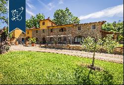 Agricultural farm with recently-renovated resort among the sweet rolling Chianti hills
