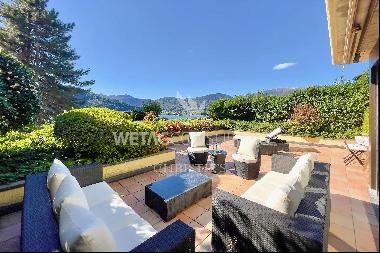 Carabietta: elegant apartment with terrace, private garden & view of Lake Lugano for sale