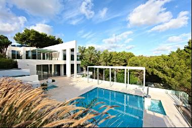 Modern designer villa in Sol de Mallorca with building plot and sea access