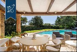 Luxury villa surrounded by a wonderful leafy garden in Porto Cervo's marina.