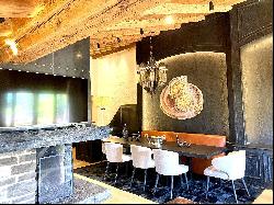 Luxury top floor chalet-style apartment in the outskirts of Gstaad with panoramic views on