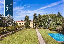 Elegant historical villa surrounded by a big private park with a pool and tennis court for