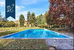 Elegant historical villa surrounded by a big private park with a pool and tennis court for