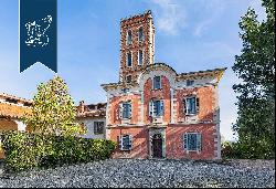 Between Italy and Switzerland: historical estate for sale with a villa, a tower, an outbui