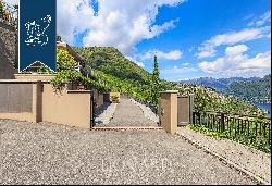 Villa with a park, pool and panoramic terraces for sale on a hill above Cernobbio
