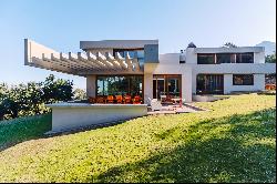 Modern house with unbeatable views of Santiago and the Andes mountain range.