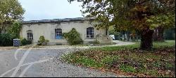 Property with outbuildings in the heart of 30 hectares of parkland