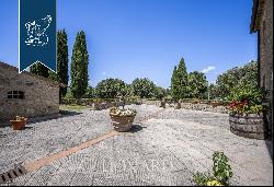 Elegant Tuscan resort with a pool, padel court and olive grove for sale in San Gimignano