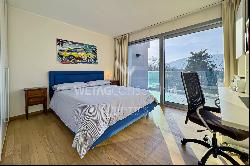 Lugano-Origlio: elegant duplex penthouse apartment with roof terrace & open view of natur