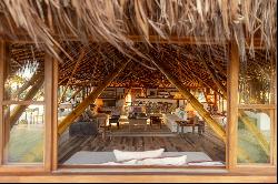 Bamboo house on a deserted and preserved beach