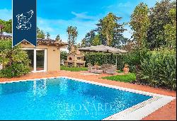 Luxury villa surrounded by nature with a pool and outbuilding for sale in Cecina