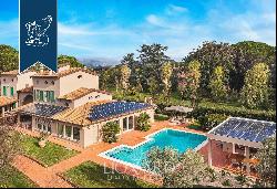 Luxury villa surrounded by nature with a pool and outbuilding for sale in Cecina
