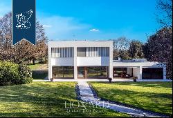 Exclusive property in a modern design with a big private park and a bocce field for sale i
