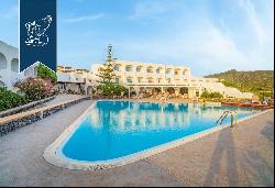Stunning hotel with a pool and tennis courts for sale on the Black Pearl of the Mediterran