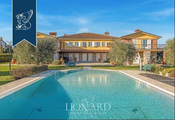 Elegant estate with a spacious pool and a private park for sale on the hills that surround