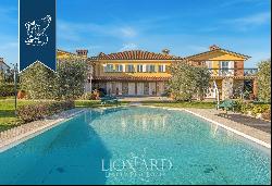 Elegant estate with a spacious pool and a private park for sale on the hills that surround