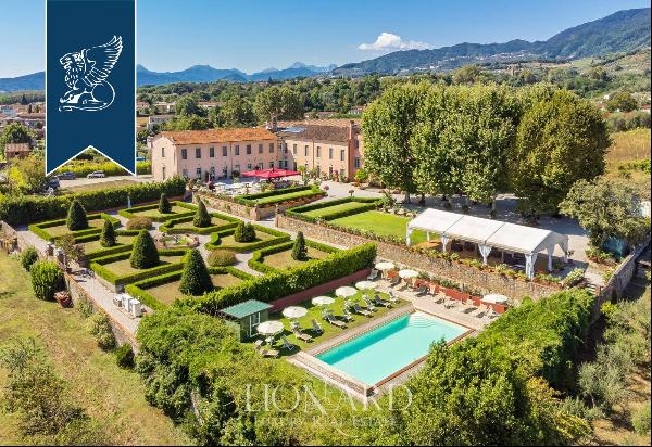 17th-century villa on the idyllic Lucchesi Hills with an Italian-style garden and a swimmi