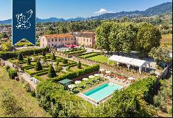 17th-century villa on the idyllic Lucchesi Hills with an Italian-style garden and a swimmi
