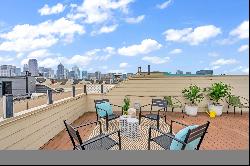 Gated Uptown Retreat with Spectacular Roofdeck Views