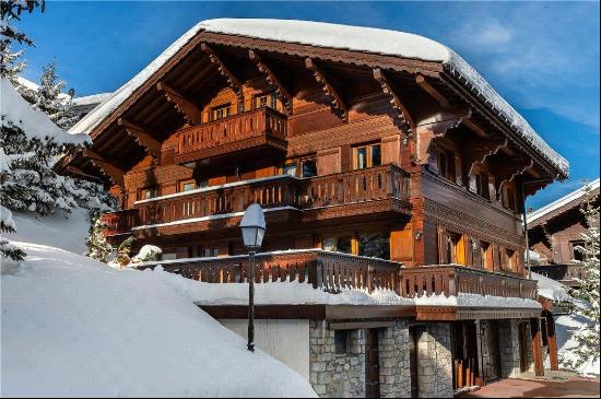 An exceptional family chalet in a secure and gated community in the heart of Courchevel.