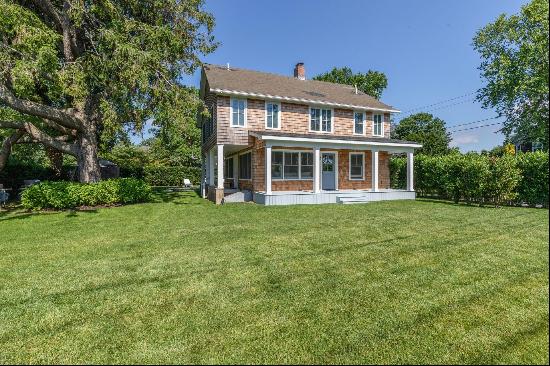 In the heart of Southampton Village, this lovely shingled Traditional Farmhouse exemplifie