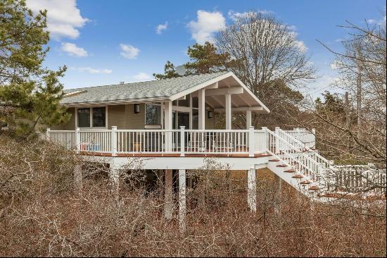 This totally renovated stylish beach cottage has four bedrooms, two baths, an open floor p