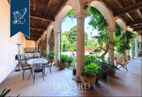 Ancient prestigious estate with a garden, pool and water spring for sale on the outskirts 