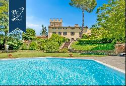 On the top of a hill around the gentle slopes of Scandicci, a historic villa with park, sw