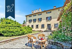 On the top of a hill around the gentle slopes of Scandicci, a historic villa with park, sw