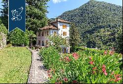 Villa with panoramic turret for sale by Lake Como