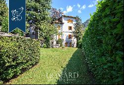 Villa with panoramic turret for sale by Lake Como