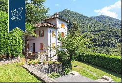 Villa with panoramic turret for sale by Lake Como