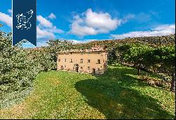 Ancient castle in a panoramic position for sale near Cortona