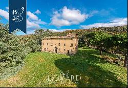 Ancient castle in a panoramic position for sale near Cortona