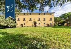 Ancient castle in a panoramic position for sale near Cortona