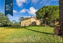 Ancient castle in a panoramic position for sale near Cortona