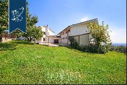 Luxury villa with pool and panoramic views of rows of vines