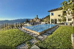 Pool & view of Lake Lugano: modern villa in Lugano-Cureggia for sale