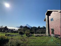 House overlooking Lake Llanquihue and volcano