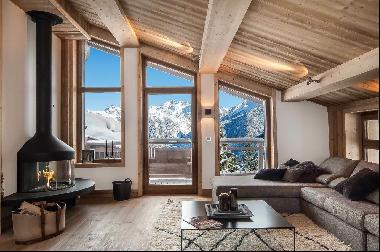 Magnificent half chalet located at the foot of the slopes of Courchevel Village.