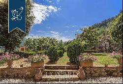 Prestigious farmstead used as a charming accommodation facility at the foot of the Monti P