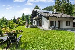 Spacious chalet with heated swimming pool and large green park