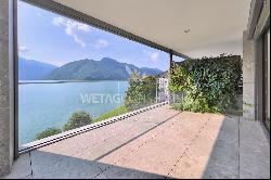 Modern apartment for sale in Lugano-Melide with breathtaking views of Lake Lugano