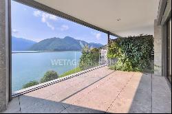 Modern apartment for sale in Lugano-Melide with breathtaking views of Lake Lugano