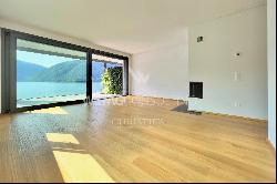 Modern apartment for sale in Lugano-Melide with breathtaking views of Lake Lugano