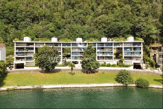 Modern apartment for sale in Lugano-Melide with breathtaking views of Lake Lugano